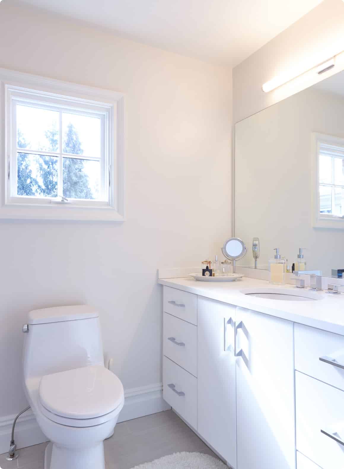 A Bathroom With A Toilet And Sink