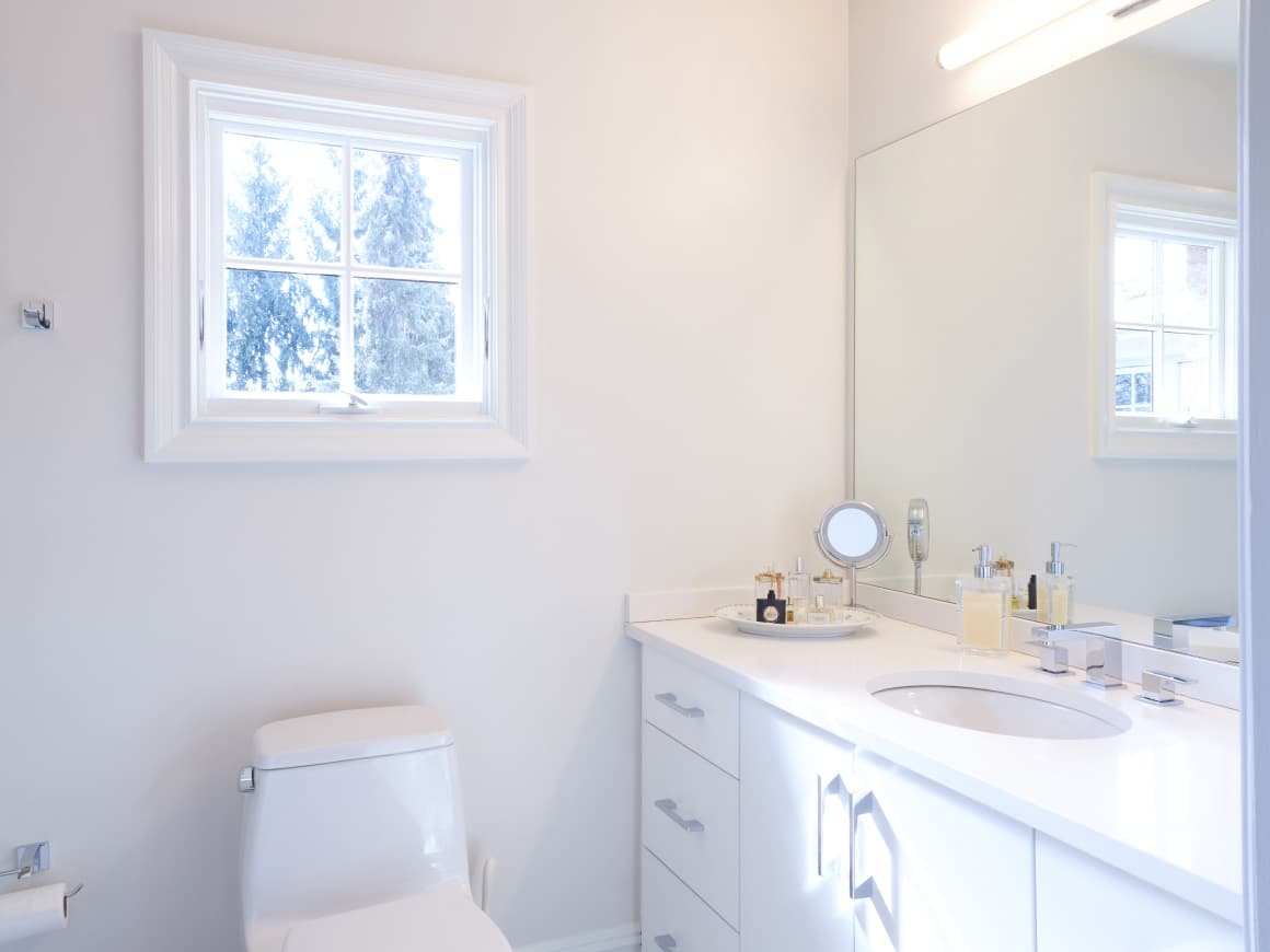 A Bathroom With A Toilet And Sink